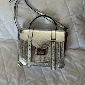 Small Silver Michael Kors handbag/cross body.